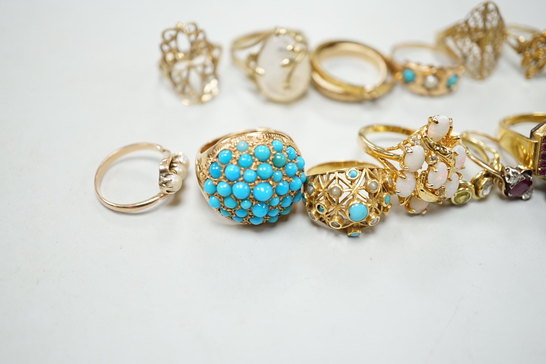 Three 18ct and gem set rings including star sapphire, turquoise and pearl and ruby and diamond three stone, five 9ct gold rings and a 9ct gold pendant mount and nine other rings including ring watch and Middle Eastern tu